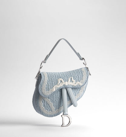 Small Saddle Luxury Handbag With Céleste Blue Oblique Embroidery And White Lace And Strap