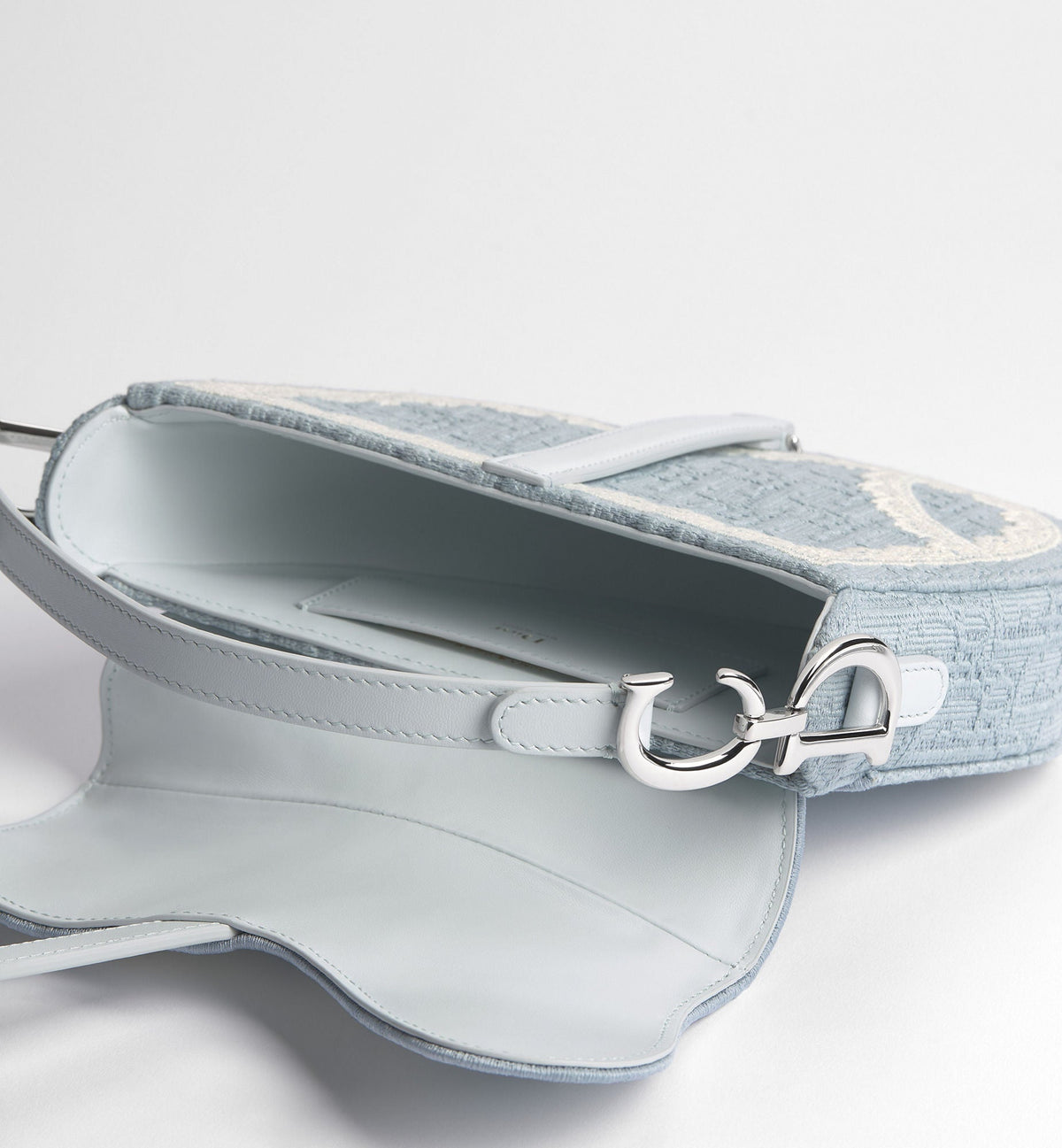 Small Saddle Luxury Handbag With Céleste Blue Oblique Embroidery And White Lace And Strap