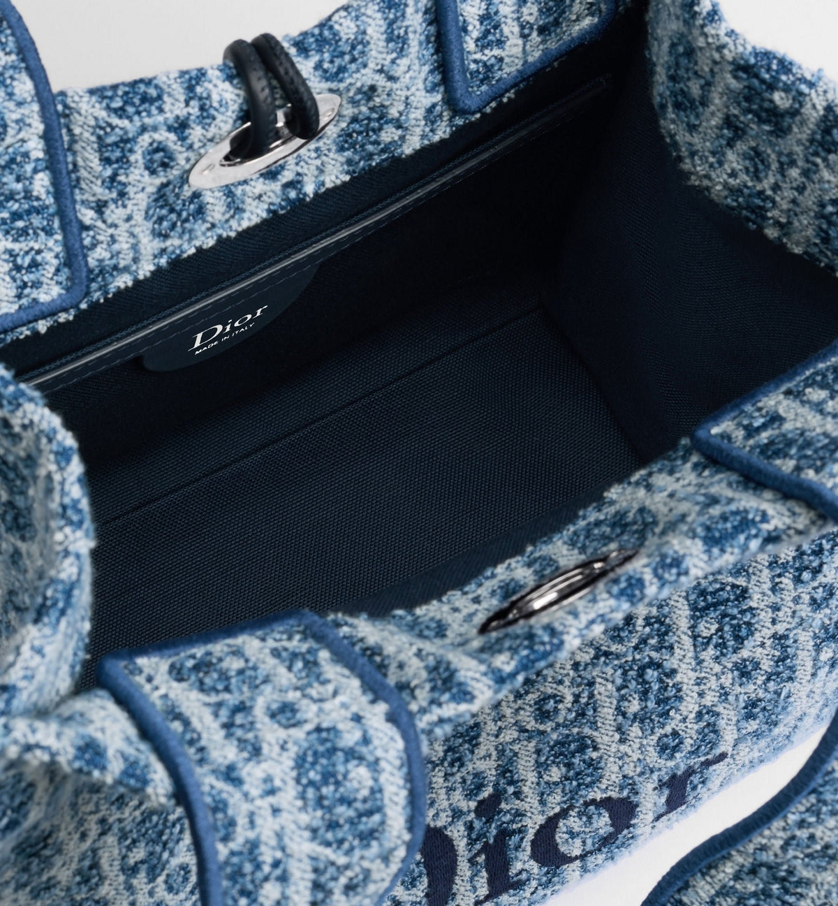 Small Spongy Book Designer Tote Bag With Blue Textured Fabric And Embroidered Signature