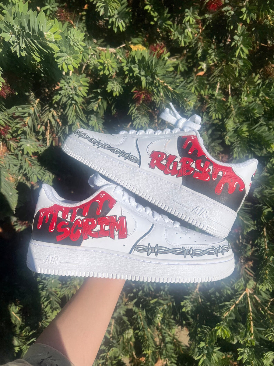 Custom Air Force 1s black and red artist themed