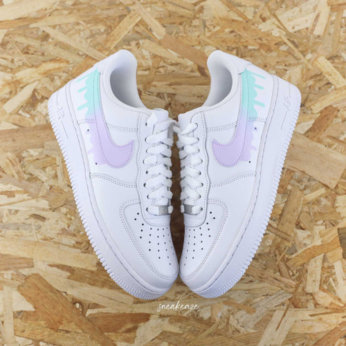 Customized Air Force 1 sneakers with a pastel drip effect and unisex design.