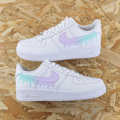 Customized Air Force 1 sneakers with a pastel drip effect and unisex design.