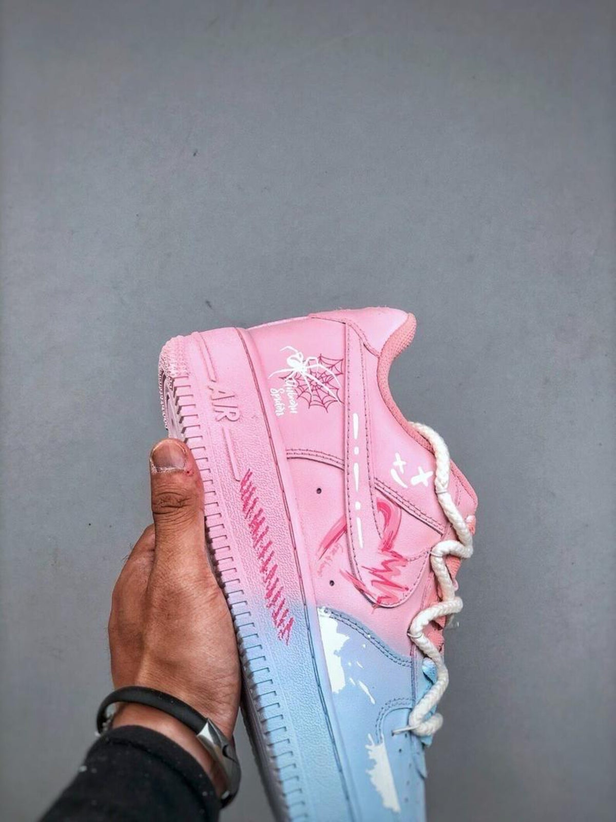 Custom handcrafted pink and blue Air Force 1 sneakers