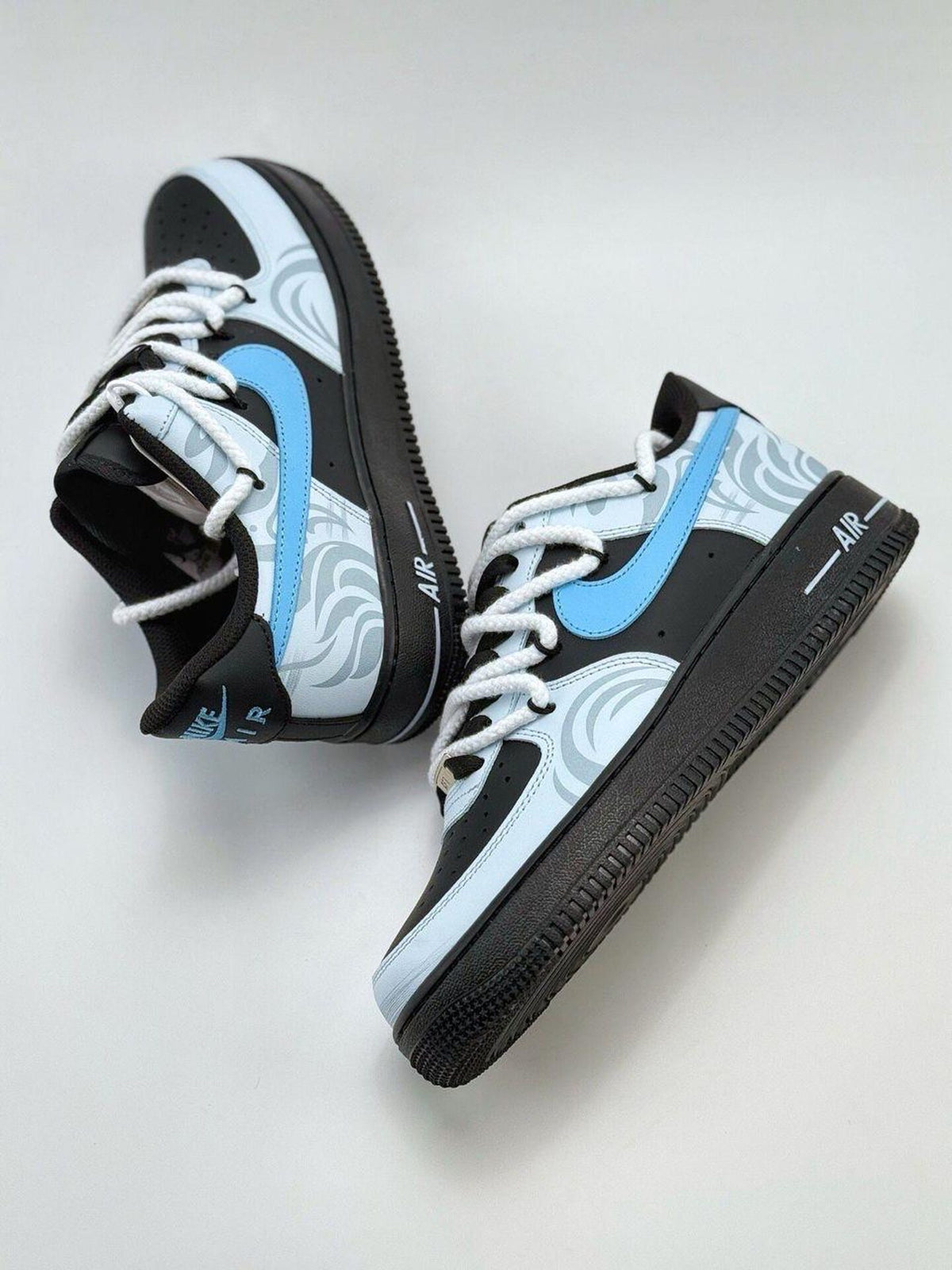 Custom handcrafted black and blue Air Force 1 sneakers