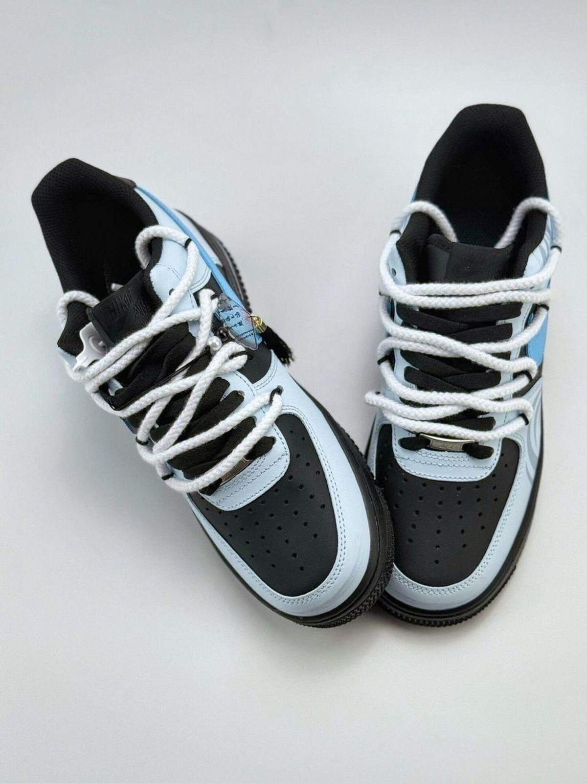 Custom handcrafted black and blue Air Force 1 sneakers