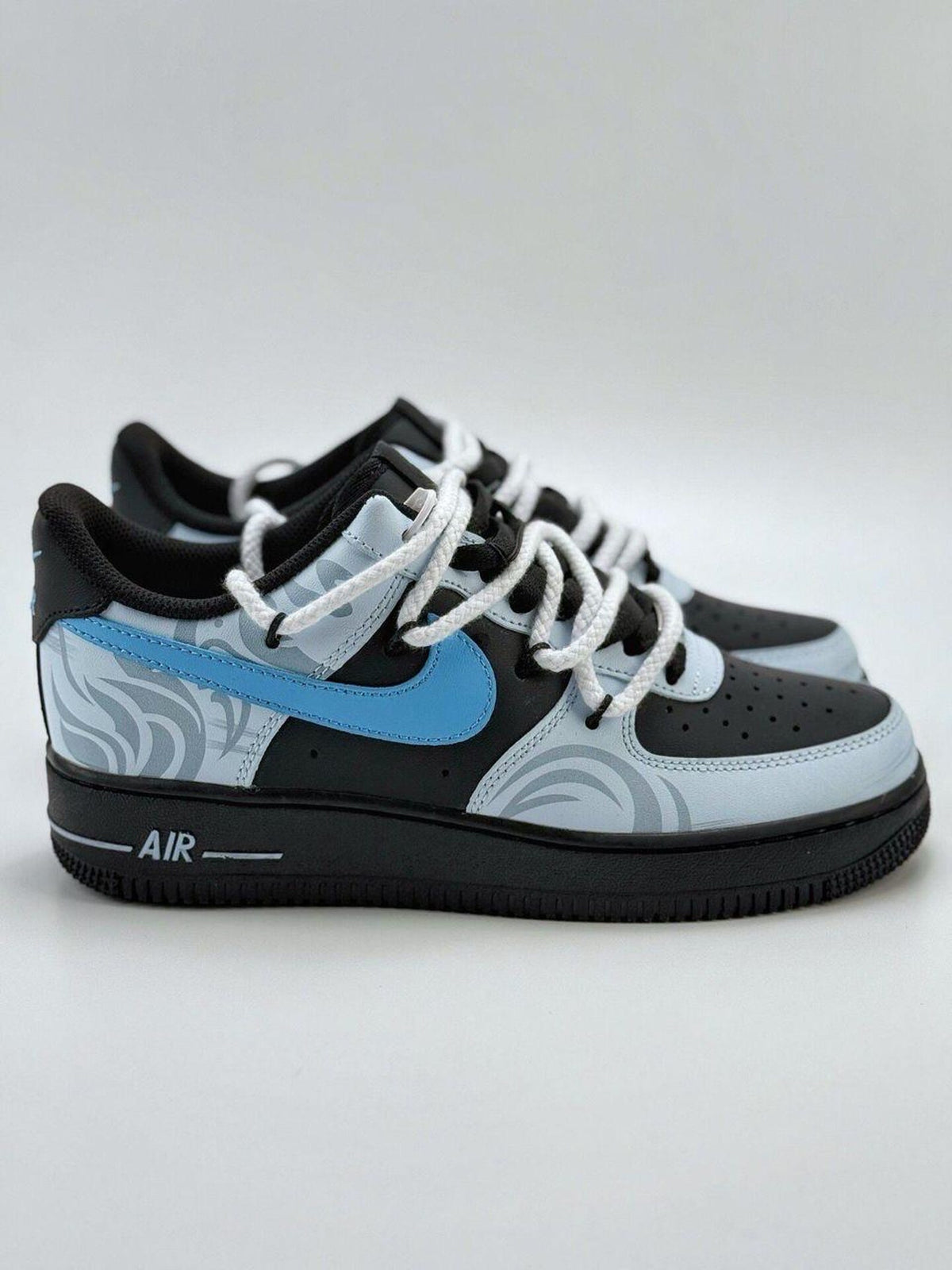 Custom handcrafted black and blue Air Force 1 sneakers