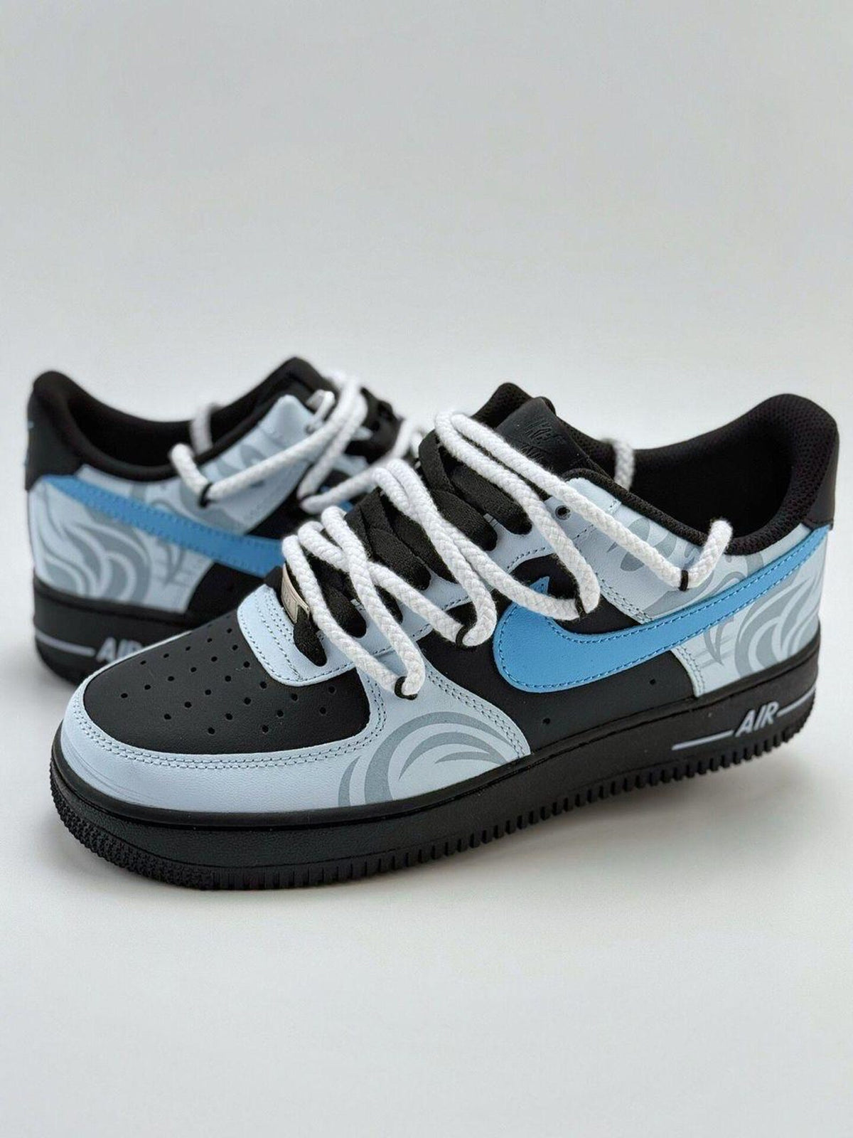 Custom handcrafted black and blue Air Force 1 sneakers