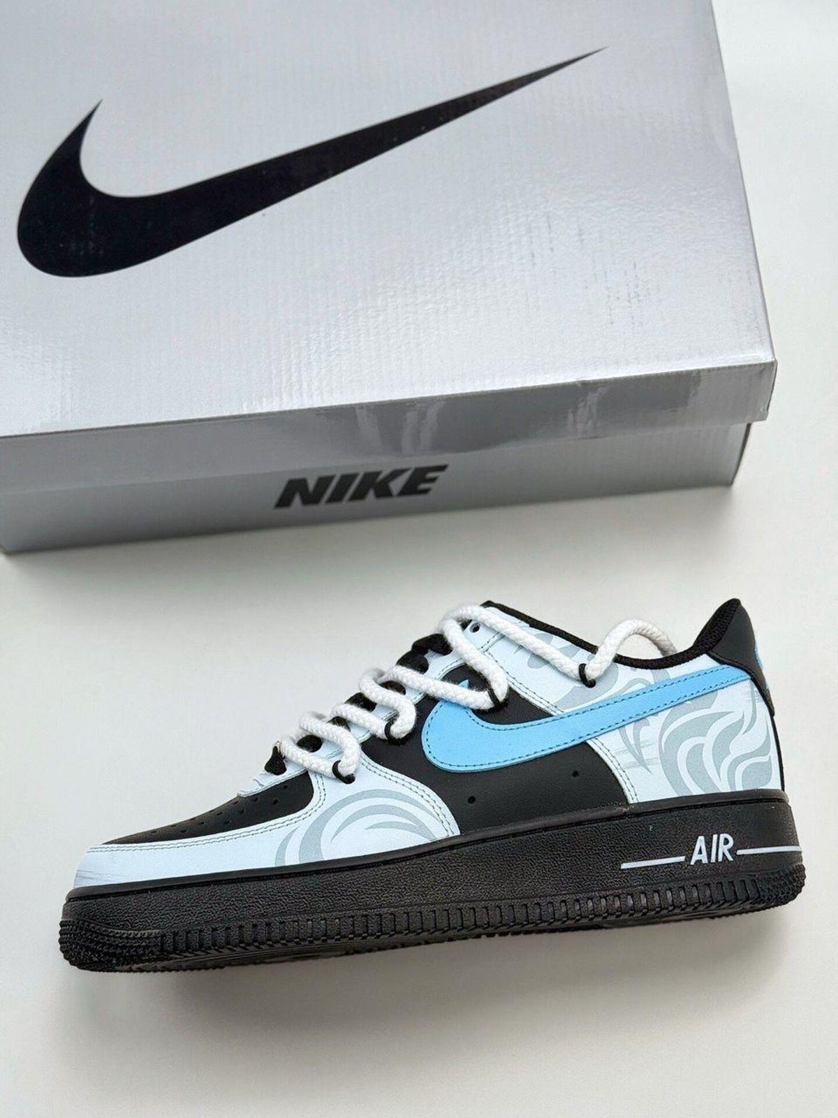 Custom handcrafted black and blue Air Force 1 sneakers