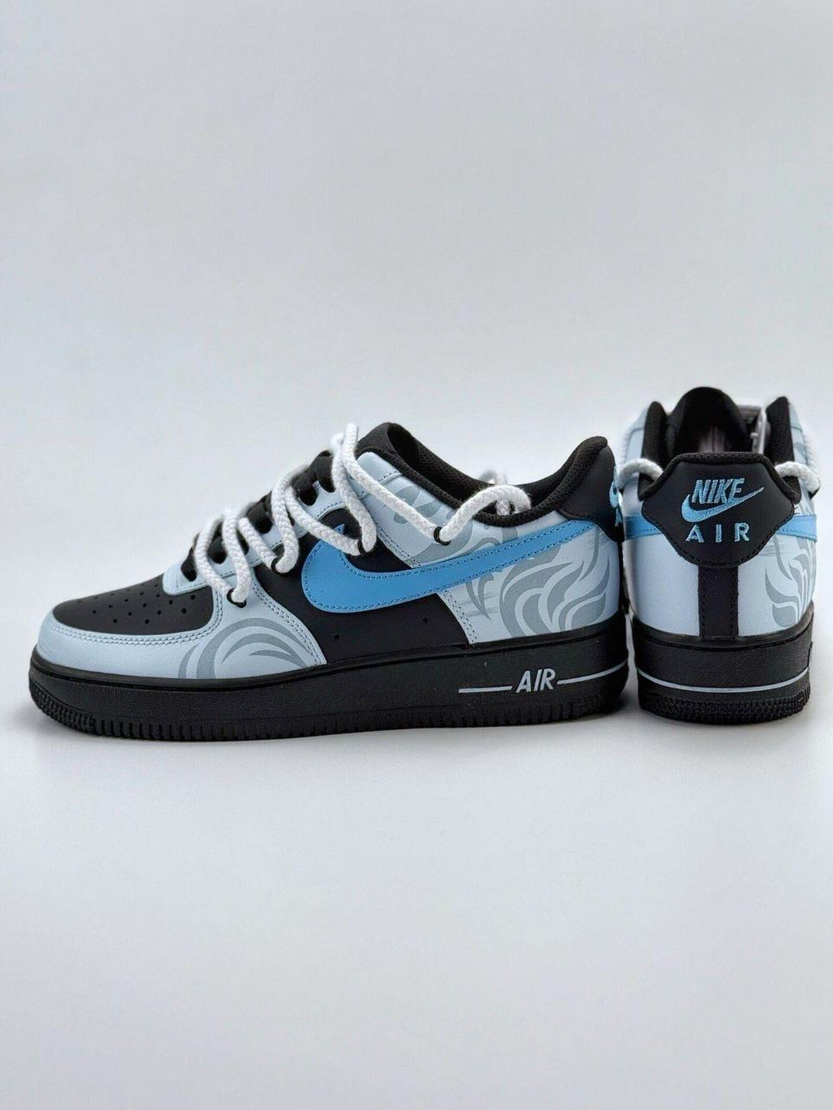 Custom handcrafted black and blue Air Force 1 sneakers